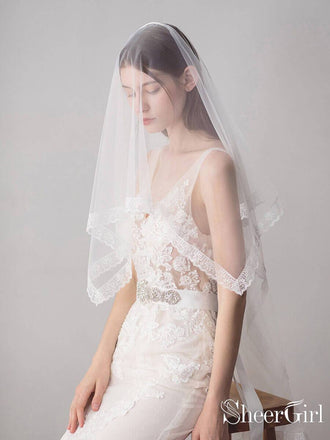 https://www.sheergirl.com/cdn/shop/products/Lace-Hemline-Ivory-Tulle-Wedding-Veils-ACC1051_27ac0c08-7f9f-487c-9f1d-8e7bf5c0b216_370x440.jpg?v=1631816893