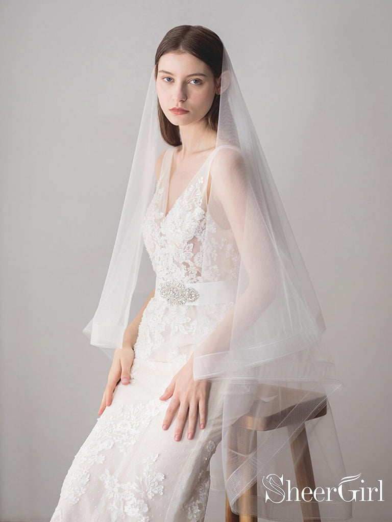 https://www.sheergirl.com/cdn/shop/products/Two-Layers-Ivory-Tulle-Knee-Length-Wedding-Veils-ACC1050-2_1ffe2e9c-d17f-4f60-91ad-70ce7d3f110a_1024x1024.jpg?v=1631816875